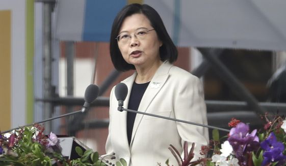 FILE - Taiwanese President Tsai Ing-wen delivers a speech during National Day celebrations in front of the Presidential Building in Taipei, Taiwan, Monday, Oct. 10, 2022. Tsai recently told Pope Francis in a letter that war with China is “not an option” and said constructive interaction with Beijing, which claims the island as part of its territory, depends on respecting self-ruled Taiwan&#39;s democracy.(AP Photo/Chiang Ying-ying, File)