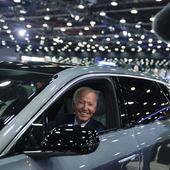 President Joe Biden drives a Cadillac Lyriq through the showroom during a tour at the Detroit Auto Show, Sept. 14, 2022, in Detroit. (AP Photo/Evan Vucci, File)
