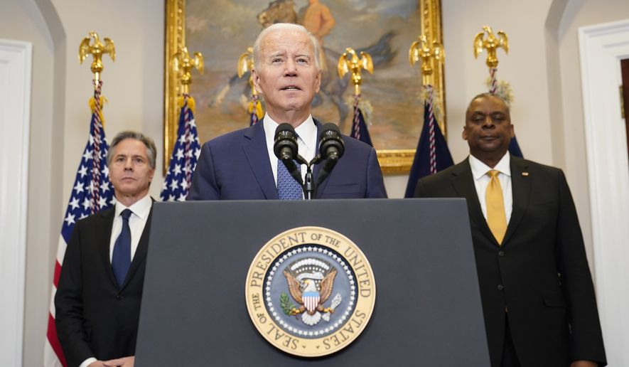 President Joe Biden speaks about Ukraine from the Roosevelt Room at the White House in Washington, Wednesday, Jan. 25, 2023, as Secretary of State Antony Blinken, left, and Defense Secretary Lloyd Austin listen. (AP Photo/Susan Walsh)