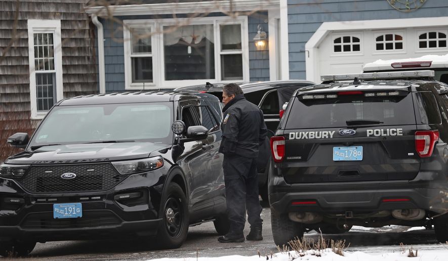 Duxbury Police work at the scene where two children were found dead and an infant injured, Wednesday, Jan. 25, 2023, in Duxbury, Mass. Authorities. responding Tuesday night to reports of a woman jumping out of a window at a house, found them unconscious with obvious signs of trauma. The mother, Lindsay Clancy, remains hospitalized and will be arraigned on homicide charges after she is released, Plymouth District Attorney Timothy Cruz said Wednesday. (David L Ryan/The Boston Globe via AP)