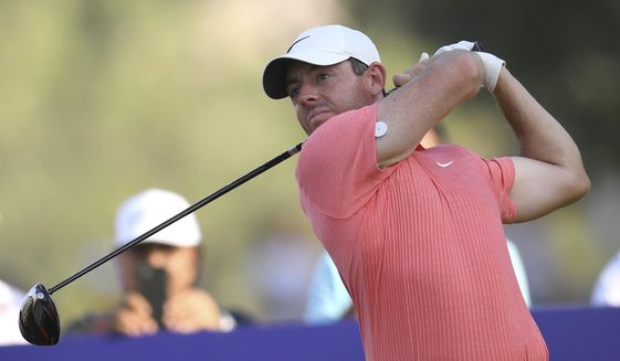 FILE - Rory McIlroy of Northern Ireland tees off at the 18th hole during DP World Tour Championship in Dubai, United Arab Emirates, on Nov. 19, 2022. McIlroy was one of the most vocal critics of the LIV Golf breakaway league last year. It left him feeling mentally drained so he decided to put his clubs away for a few weeks around Christmas. Now he’s back and appears to be as fiery as ever as he prepares to play the Dubai Desert Classic. (AP Photo/Martin Dokoupil, File)