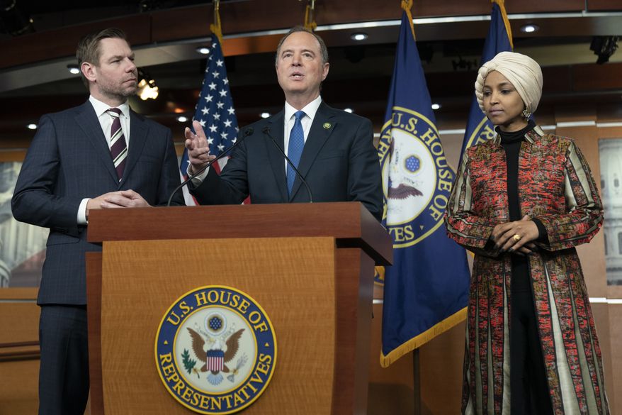 Rep. Adam Schiff, D-Calif., center, with Rep. Eric Swalwell, D-Calif., left, and Rep. Ilhan Omar, D-Minn., speaks during a news conference on Capitol Hill in Washington, Wednesday, Jan. 25, 2023, in Washington. Minority Leader Hakeem Jeffries of N.Y., has nominated the two California lawmakers for the Intelligence Committee in open defiance of House Speaker Kevin McCarthy&#x27;s vow to block them. Jeffries asked that Schiff and Swalwell be reappointed to the Intelligence panel. (AP Photo/Manuel Balce Ceneta)