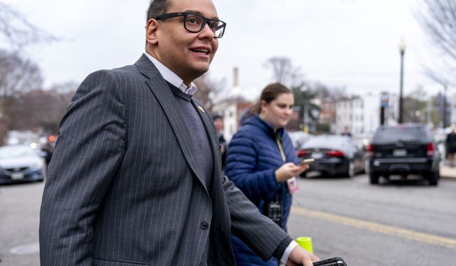 Rep. George Santos, R-N.Y., leaves a House GOP conference meeting on Capitol Hill in Washington, Wednesday, Jan. 25, 2023. (AP Photo/Andrew Harnik)