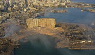 A drone picture shows the scene of an explosion that hit the seaport of Beirut, on Aug. 5, 2020. Lebanon’s top prosecutor Wednesday Jan. 25, 2023 ordered all suspects detained in the deadly 2020 port blast released, a lawyer for two detainees and judicial officials said. (AP Photo/Hussein Malla, File)