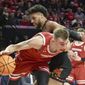 Wisconsin&#39;s Tyler Wahl (5) barrels past Maryland&#39;s Patrick Emilien (15) during the first half of an NCAA college basketball game, Wednesday, Jan. 25, 2023 in College Park, Md. (Amy Davis/The Baltimore Sun via AP)