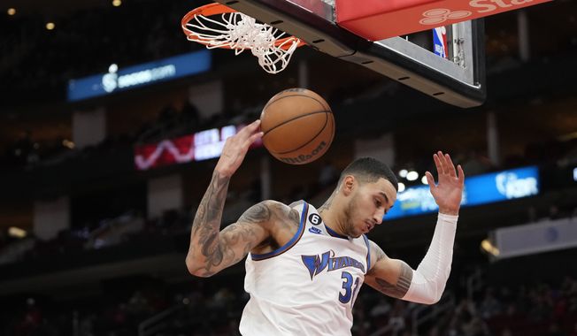 Washington Wizards&#x27; Kyle Kuzma dunks the ball during the second half of an NBA basketball game against the Houston Rockets Wednesday, Jan. 25, 2023, in Houston. The Wizards won 108-103. (AP Photo/David J. Phillip)