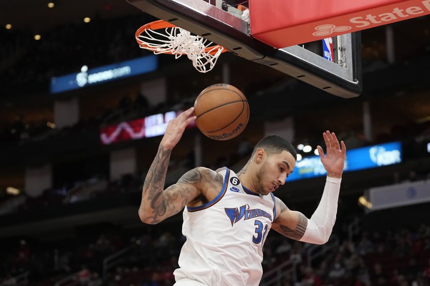 Washington Wizards&#x27; Kyle Kuzma dunks the ball during the second half of an NBA basketball game against the Houston Rockets Wednesday, Jan. 25, 2023, in Houston. The Wizards won 108-103. (AP Photo/David J. Phillip)