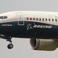 A Boeing 737 Max jet prepares to land at Boeing Field following a test flight in Seattle, Sept. 30, 2020. Boeing representatives and relatives of some of the passengers killed in two crashes of Boeing 737 Max jets will meet face-to-face in a Texas courtroom Thursday, Jan. 26, 2023, where the aerospace giant will be arraigned on a criminal charge that it thought it had settled two years ago. (AP Photo/Elaine Thompson, File)