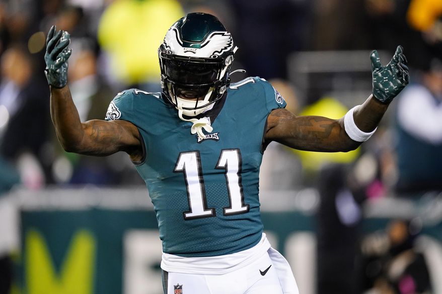Philadelphia Eagles wide receiver A.J. Brown reacts after teammate Boston Scott scored on a touchdown run against the New York Giants during the first half of an NFL divisional round playoff football game, Saturday, Jan. 21, 2023, in Philadelphia. (AP Photo/Chris Szagola)
