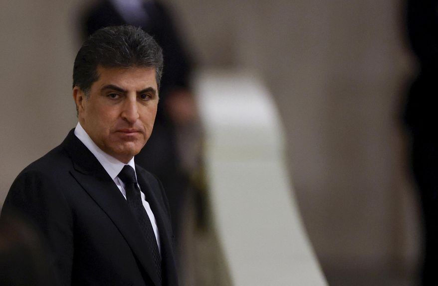 The president of the Kurdistan region in Iraq, Nechirvan Barzani, pays his respects to Britain's Queen Elizabeth II, following her death, during her lying in state at Westminster Hall, in Westminster Palace, in London, Sunday, Sept. 18, 2022. (John Sibley/Pool Photo via AP, File)