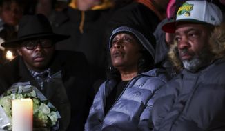The parents of Tyre Nichols, Mama Rose and Rodney Wells, attend a candlelight vigil for Tyre Nichols, who died after being beaten by Memphis police officers, in Memphis, Tenn., Thursday, Jan. 26, 2023. (Patrick Lantrip/Daily Memphian via AP)