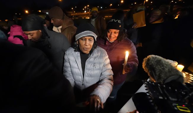RowVaughn Wells, mother of Tyre Nichols, who died after being beaten by Memphis police officers, leaves at the conclusion of a candlelight vigil for Tyre, in Memphis, Tenn., Thursday, Jan. 26, 2023. (AP Photo/Gerald Herbert)