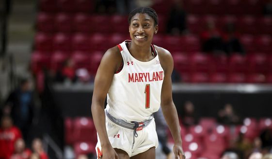 Maryland guard Diamond Miller smiles during the second half of the team&#x27;s NCAA college basketball game against Michigan, Thursday, Jan. 26, 2023, in College Park, Md. (AP Photo/Julia Nikhinson) **FILE**