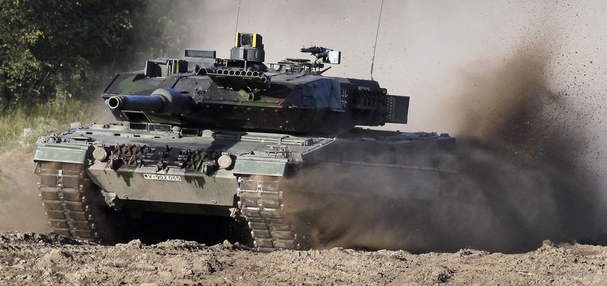 A Leopard 2 tank is pictured during a demonstration event held for the media by the German Bundeswehr in Munster near Hannover, Germany, Wednesday, Sept. 28, 2011. The German government has confirmed it will provide Ukraine with Leopard 2 battle tanks and approve requests by other countries to do the same. Chancellor Olaf Scholz said Wednesday that Germany was “acting in close coordination” with its allies. (AP Photo/Michael Sohn) **FILE**