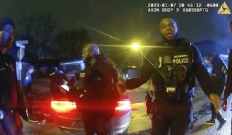 The image from video released on Jan. 27, 2023, by the City of Memphis, shows police officers talking after a brutal attack on Tyre Nichols by five Memphis police officers on Jan. 7, 2023, in Memphis, Tenn. Nichols died on Jan. 10. The five officers have since been fired and charged with second-degree murder and other offenses. (City of Memphis via AP)