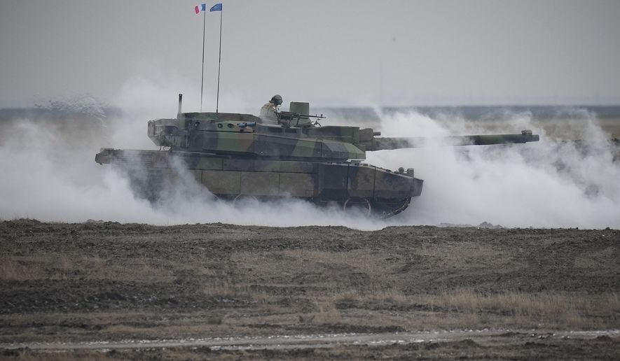 A French Leclerc main battle tank is engulfed by smoke during an exercise at a training range in Smardan, eastern Romania, Wednesday, Jan. 25, 2023. Around 600 French soldiers deployed to Romania as part of a NATO battlegroup on the alliance&#x27;s eastern flank carried out live combat exercises on Wednesday to test their preparedness amid Russia&#x27;s ongoing war in neighboring Ukraine. (AP Photo/Vadim Ghirda)