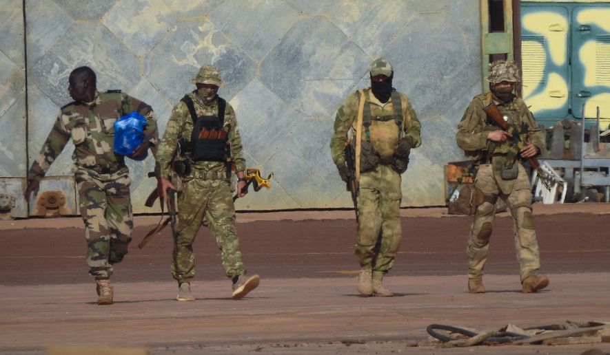 This undated photograph handed out by French military shows three Russian mercenaries, right, in northern Mali. Russia&#x27;s Wagner Group, a private military company led by Yevgeny Prigozhin, a rogue millionaire with longtime links to Russia&#x27;s President Vladimir Putin, has played a key role in the fighting in Ukraine and also deployed its personnel to Syria, Central African Republic, Libya and Mali. (French Army via AP, File)