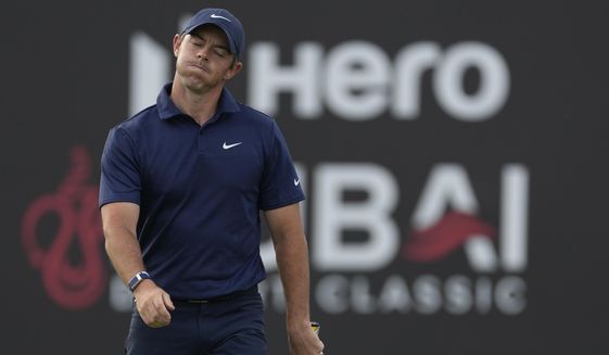 Rory McIlroy of Northern Ireland reacts after missing a ball on the 18th hole during the competition of the second round of the Dubai Desert Classic, in Dubai, United Arab Emirates, Saturday, Jan. 28, 2023. (AP Photo/Kamran Jebreili)