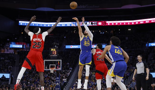 Golden State Warriors guard Stephen Curry (30) shoots against Toronto Raptors forward Chris Boucher (25) during the second half of an NBA basketball game in San Francisco, Friday, Jan. 27, 2023. (AP Photo/Jed Jacobsohn)