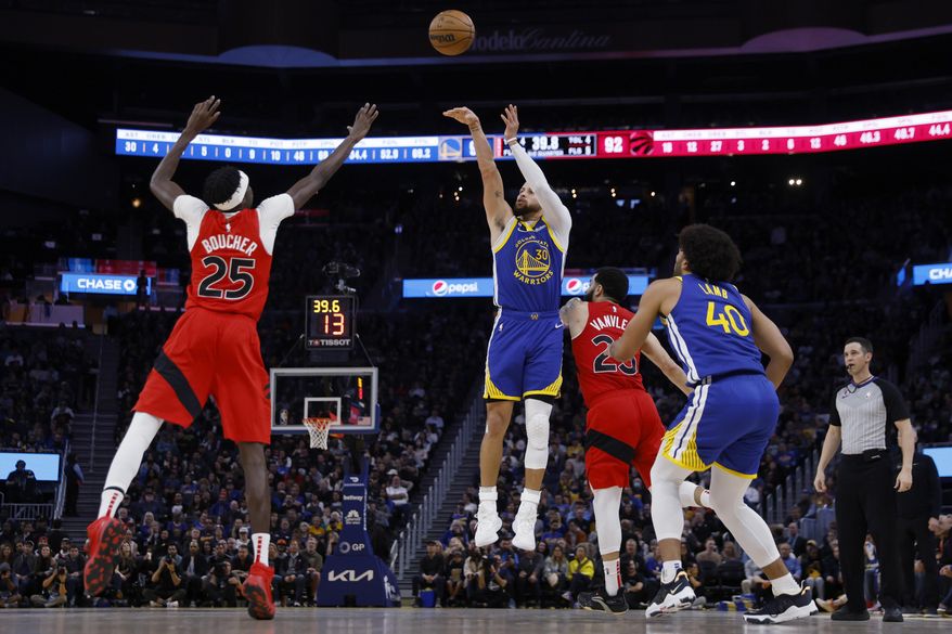 Golden State Warriors guard Stephen Curry (30) shoots against Toronto Raptors forward Chris Boucher (25) during the second half of an NBA basketball game in San Francisco, Friday, Jan. 27, 2023. (AP Photo/Jed Jacobsohn)