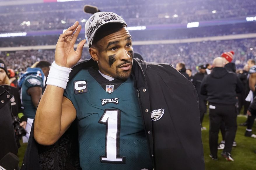Philadelphia Eagles quarterback Jalen Hurts walks on the field after the NFC Championship NFL football game between the Philadelphia Eagles and the San Francisco 49ers on Sunday, Jan. 29, 2023, in Philadelphia. The Eagles won 31-7. (AP Photo/Seth Wenig)
