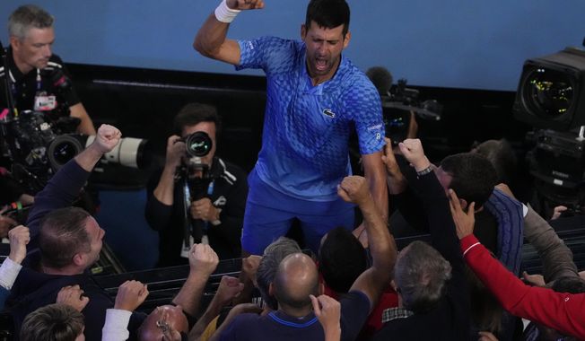 Novak Djokovic of Serbia celebrates after defeating Stefanos Tsitsipas of Greece in the men&#x27;s singles final at the Australian Open tennis championships in Melbourne, Australia, Sunday, Jan. 29, 2023. (AP Photo/Ng Han Guan)