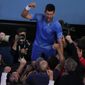 Novak Djokovic of Serbia celebrates after defeating Stefanos Tsitsipas of Greece in the men&#39;s singles final at the Australian Open tennis championships in Melbourne, Australia, Sunday, Jan. 29, 2023. (AP Photo/Ng Han Guan)
