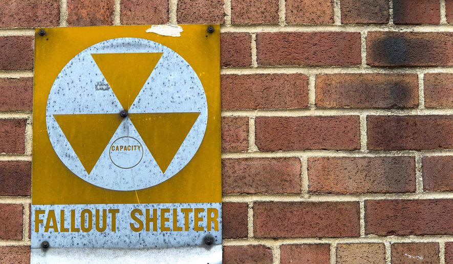 A fallout shelter sign hangs on a building on East 9th Street in New York on Jan. 16, 2018. (AP Photo/Mary Altaffer)