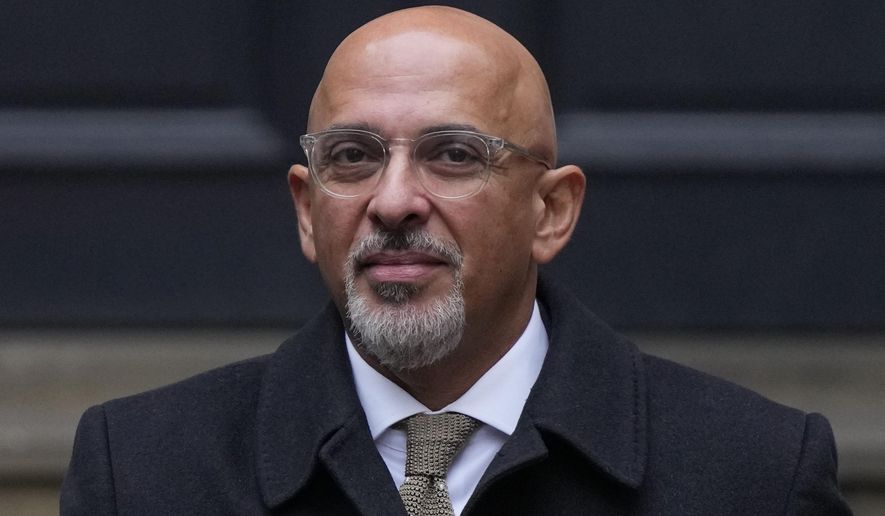 FILE - Conservative Party chairman Nadhim Zahawi leaves the Conservative Party head office in Westminster, central London, Tuesday, Jan. 24, 2023. British Prime Minister Rishi Sunak has fired the chairman of his ruling Conservative Party chairman over a “serious breach” of the ministerial code. Pressure had been building on Nadhim Zahawi amid allegations he settled a multimillion-dollar unpaid tax bill while he was in charge of the country’s Treasury. (AP Photo/Alastair Grant, File)
