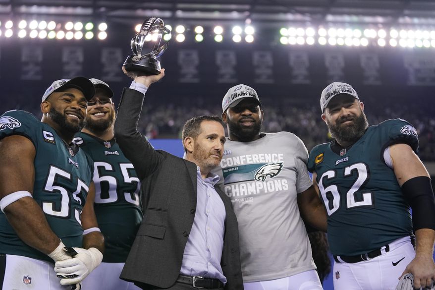 Philadelphia Eagles general manager Howie Roseman, center, stands with defensive end Brandon Graham (55) offensive tackle Lane Johnson (65), defensive tackle Fletcher Cox, and center Jason Kelce (62) after the NFC Championship NFL football game between the Philadelphia Eagles and the San Francisco 49ers on Sunday, Jan. 29, 2023, in Philadelphia. The Eagles won 31-7. (AP Photo/Matt Slocum)