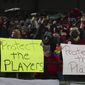 Portland Thorns fans hold signs during the first half of the team&#x27;s NWSL soccer match against the Houston Dash in Portland, Ore., Oct. 6, 2021. On Monday, Jan. 30, 2023, U.S. Soccer introduced a Safe Soccer program that will require comprehensive vetting of individuals involved in the sport as the federation continues to address its investigation into coach misconduct in the National Women&#x27;s Soccer League. (AP Photo/Steve Dipaola, File) **FILE**