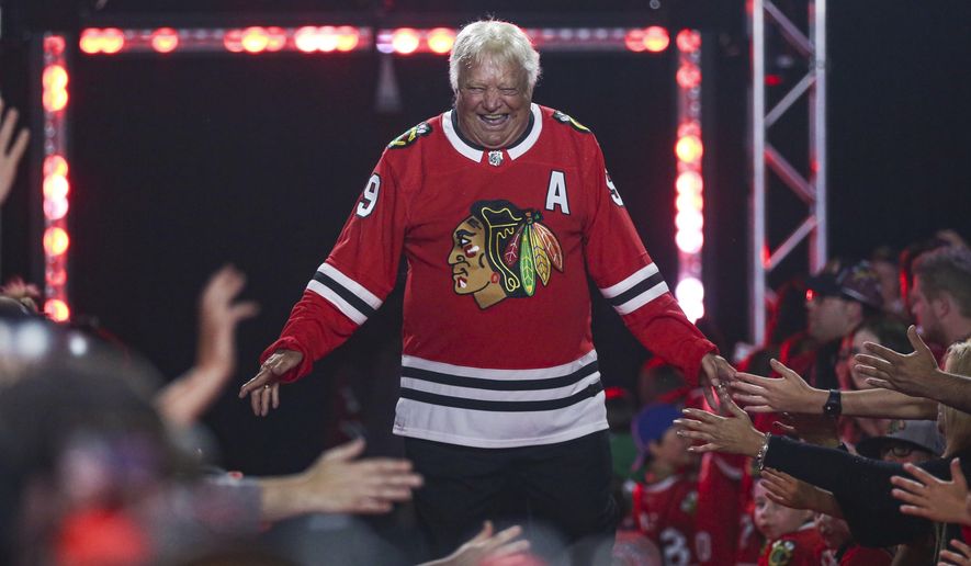 Former Chicago Blackhawks player Bobby Hull is introduced to fans during the NHL hockey team&#x27;s convention in Chicago, July 26, 2019. Hull, a Hall of Fame forward who helped the Blackhawks win the 1961 Stanley Cup Final, has died. He was 84. The Blackhawks and the NHL Alumni Association announced the death of the two-time NHL MVP on Monday, Jan. 30, 2023. (AP Photo/Amr Alfiky, file) **FILE**