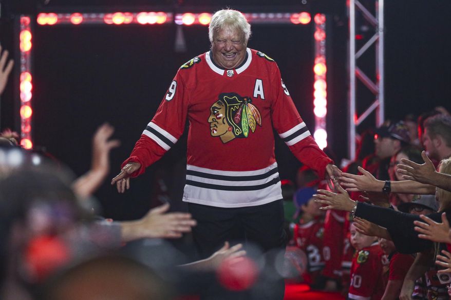 Former Chicago Blackhawks player Bobby Hull is introduced to fans during the NHL hockey team's convention in Chicago, July 26, 2019. Hull, a Hall of Fame forward who helped the Blackhawks win the 1961 Stanley Cup Final, has died. He was 84. The Blackhawks and the NHL Alumni Association announced the death of the two-time NHL MVP on Monday, Jan. 30, 2023. (AP Photo/Amr Alfiky, file) **FILE**