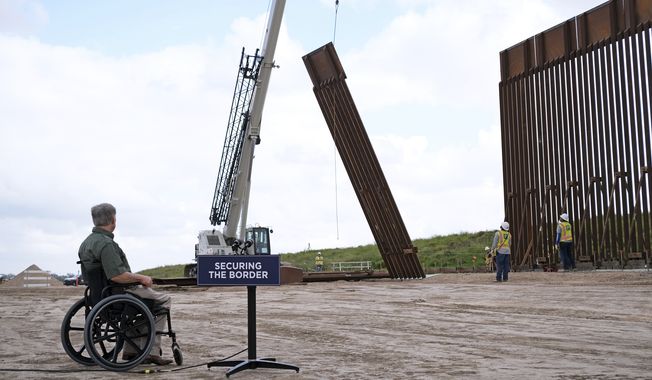 Texas Gov. Greg Abbott visits San Benito, Texas, as he observes a section of the U.S. border fence being installed Monday, Jan. 30, 2023, during a press conference on the state&#x27;s efforts to better secure the border region. (Miguel Roberts/The Brownsville Herald via AP)