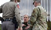 Texas Gov. Greg Abbott visits San Benito, Texas, near a U.S. border fence construction site Monday, Jan. 30, 2023, as he prepares to shake the hand of Adjutant Gen. of the Texas Military Department Major Gen. Thomas M. Suelzer during a press conference on the state&#39;s efforts to better secure the border region. (Miguel Roberts/The Brownsville Herald via AP) **FILE**