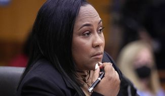 Fulton County District Attorney Fani Willis watches proceedings during a hearing to decide if the final report by a special grand jury looking into possible interference in the 2020 presidential election can be released Jan. 24, 2023, in Atlanta. (AP Photo/John Bazemore, File)