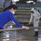 In this photo published on June 28, 2022, by the North Korean government, North Korean employees disinfect a facility at an underground store in Pyongyang, North Korea. Independent journalists were not given access to cover the event depicted in this image distributed by the North Korean government. The content of this image is as provided and cannot be independently verified. Korean language watermark on image as provided by source reads: &quot;KCNA&quot; which is the abbreviation for Korean Central News Agency. (Korean Central News Agency/Korea News Service via AP, File)