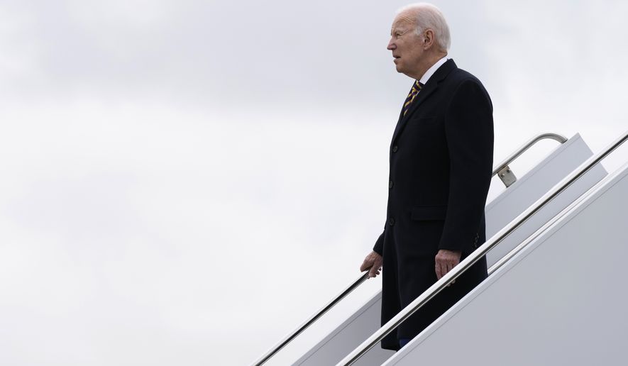 President Joe Biden walks down the steps of Air Force One at John F. Kennedy International Airport, in New York, Tuesday, Jan. 31, 2023, as he heads to the construction site of the Hudson Tunnel Project. (AP Photo/Susan Walsh)