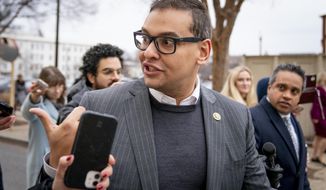 Rep. George Santos, R-N.Y., leaves a House GOP conference meeting on Capitol Hill in Washington, Jan. 25, 2023. Santos told Republican colleagues in a closed-door meeting Tuesday he won&#39;t serve on his two committees for now, GOP lawmakers say. (AP Photo/Andrew Harnik, File)