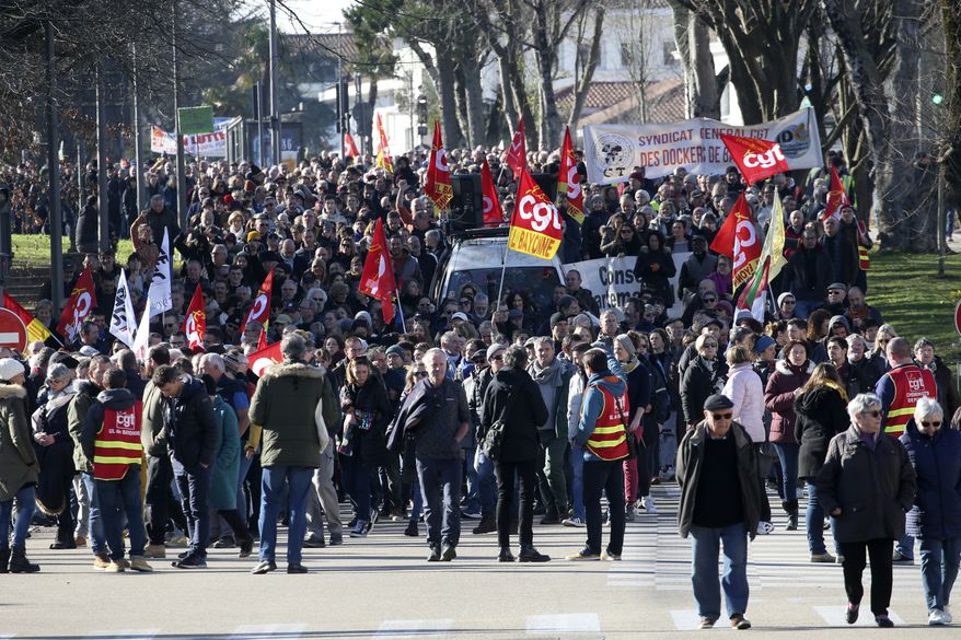 Demonstrators against French government pension reforms take part to a protest march, in Bayonne, southwestern France, Tuesday, Jan. 31, 2023. French labor leaders hope to bring more than 1 million demonstrators into the streets again in the latest clash of wills with the government over plans to push back France's retirement age. (AP Photo/Robert Edme)