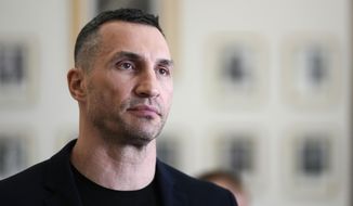 Former heavyweight boxing world champion Wladimir Klitschko leaves after a meeting with German Economy and Climate Minister Robert Habeck in Berlin, March 31, 2022. Olympic gold medalist Wladimir Klitschko has joined Ukraine’s fight against IOC plans to let some Russians compete at the 2024 Paris Summer Games, it was announced Tuesday, Jan. 31, 2023. The former heavyweight world champion has suggested in a video message sports leaders will be accomplices to the war if athletes from Russia and its military ally Belarus can compete at the next Olympics. (AP Photo/Markus Schreiber, file)