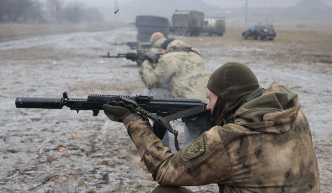 Russian army soldiers practice on a military training ground in Russian-controlled Donetsk region, eastern Ukraine, Tuesday, Jan. 31, 2023. (AP Photo/Alexei Alexandrov)