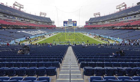 A stadium view of Tennessee Titans&#x27; Nissan Stadium as fans begin to arrive before an NFL football game against the ,Jacksonville Jaguars, Dec. 11, 2022, in Nashville, Tenn. The Titans are tearing up the grass and replacing the field with a synthetic surface before the 2023 season. The Titans announced the change Tuesday, Jan. 31, 2023. (AP Photo/Peter Joneleit)
