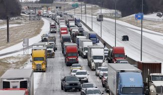Traffic sits at a standstill along westbound I-20 near Cedar Ridge Drive and Loop 408 in Dallas, Tuesday, Jan. 31, 2023. Several vehicles, including semi-trucks, were unable to make it up a hill causing traffic to stop. (Elías Valverde II/The Dallas Morning News via AP)