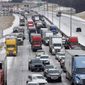 Traffic sits at a standstill along westbound I-20 near Cedar Ridge Drive and Loop 408 in Dallas, Tuesday, Jan. 31, 2023. Several vehicles, including semi-trucks, were unable to make it up a hill causing traffic to stop. (Elías Valverde II/The Dallas Morning News via AP)
