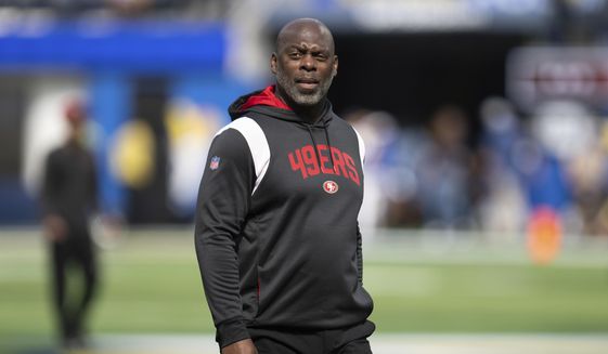 San Francisco 49ers assistant head coach Anthony Lynn walks on the field during an NFL football game against the Los Angeles Rams on Oct. 30, 2022, in Inglewood, Calif. The Washington Commanders said Wednesday, Feb. 1, 2023, that they are interviewing Lynn for their offensive coordinator vacancy. (AP Photo/Kyusung Gong, File) **FILE**
