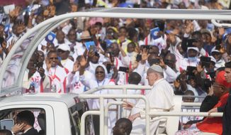 Pope Francis on the popemobile arrives at Ndolo airport where he will preside over the Holy Mass in Kinshasa, Congo, Wednesday Feb. 1, 2023. Francis is in Congo and South Sudan for a six-day trip, hoping to bring comfort and encouragement to two countries that have been riven by poverty, conflicts and what he calls a &quot;colonialist mentality&quot; that has exploited Africa for centuries. (AP Photo/Gregorio Borgia)