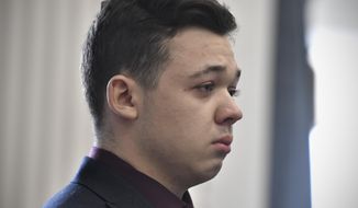 Kyle Rittenhouse keeps his composure while starting to cry as he is found not guilty on all counts on Nov. 19, 2021, at the Kenosha County Courthouse in Kenosha, Wis. A federal judge in Wisconsin on Wednesday, Feb. 1, 2023, ruled that a civil rights wrongful death lawsuit filed by the father of a man shot and killed by Rittenhouse during a protest in 2020 can proceed against city officials, police officers, Rittenhouse and others. (Sean Krajacic/The Kenosha News via AP, Pool, File)
