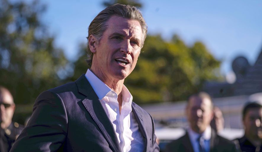 California Gov. Gavin Newsom speaks Tuesday, Jan. 24, 2023, at the I.D.E.S. Portuguese Hall in Half Moon Bay, Calif., with victims&#x27; families, local leaders and community members that were impacted by the devastating shootings the day before. (AP Photo/ Aaron Kehoe)