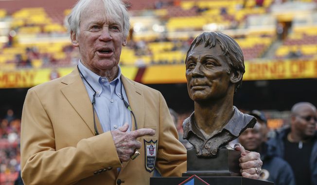 FILE - Former Washington Redskins general manager Bobby Beathard poses with his Hall of Fame trophy during halftime of an NFL football game between the Houston Texans and the Washington Redskins, Nov. 18, 2018 in Landover, Md. The four-time Super Bowl winning executive has died. He was 86. A spokesperson for the Washington Commanders said Beathard&#x27;s family told the team he died earlier this week at his home in Franklin, Tennessee. (AP Photo/Alex Brandon, file)